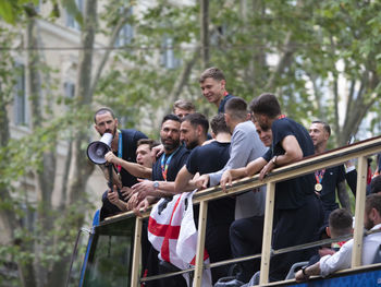 People photographing by railing