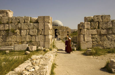 Women taking selfie against old ruins