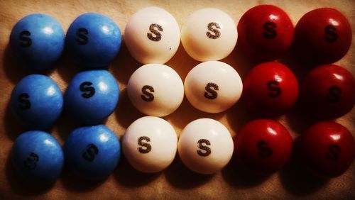 Close-up of multi colored balls on table