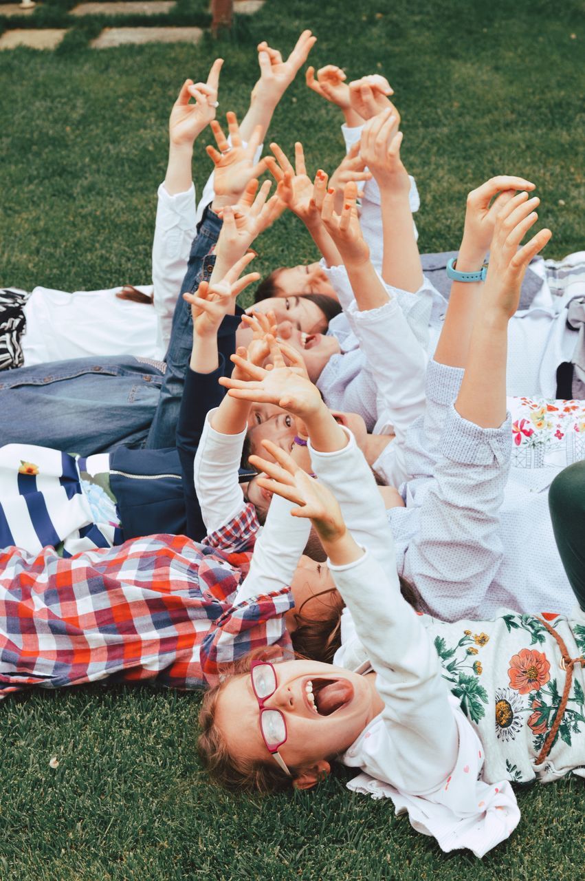 real people, group of people, grass, men, togetherness, leisure activity, field, enjoyment, full length, day, women, lifestyles, friendship, nature, people, emotion, happiness, casual clothing, land, plant, human arm, positive emotion, arms raised, outdoors