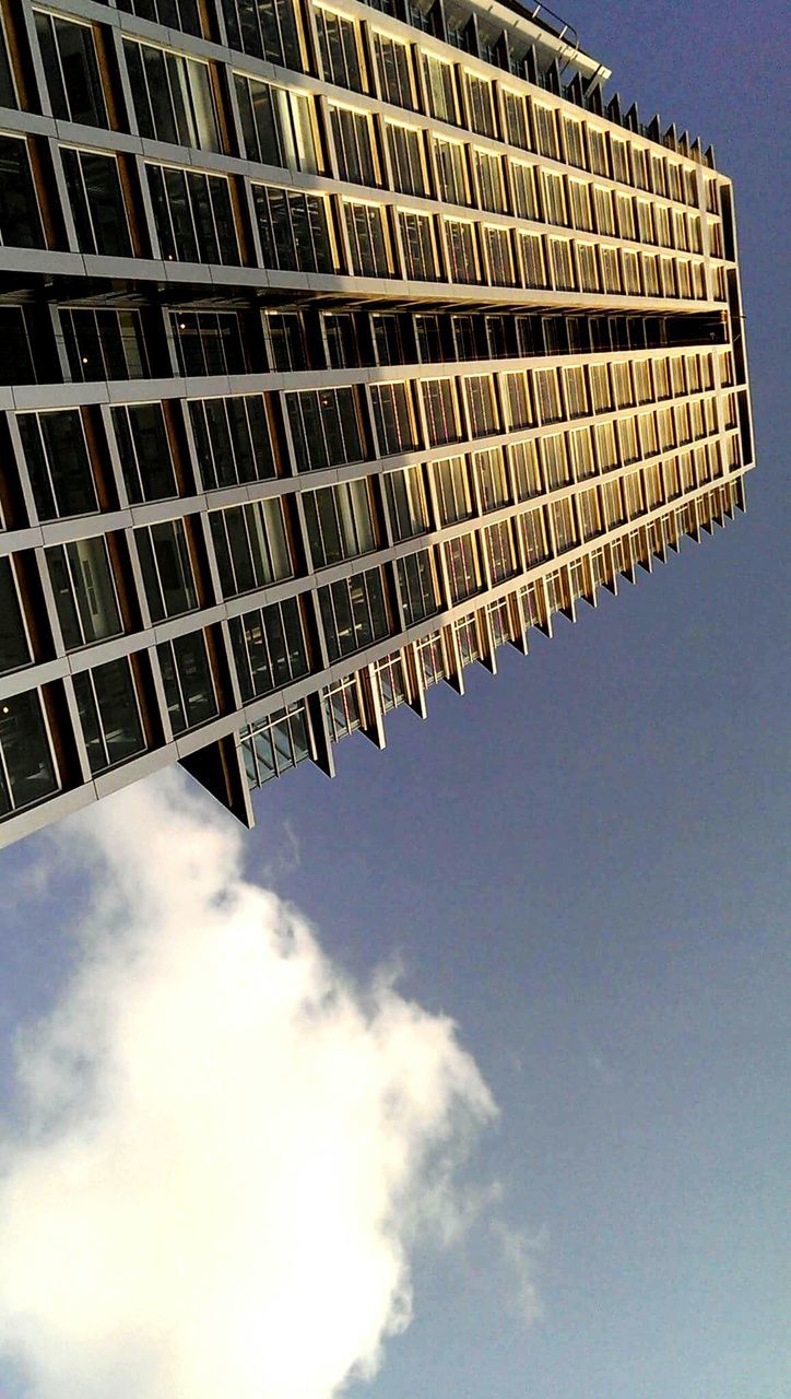 low angle view, architecture, building exterior, built structure, sky, modern, tall - high, tower, office building, building, city, skyscraper, day, outdoors, tall, cloud - sky, no people, cloud, clear sky, blue