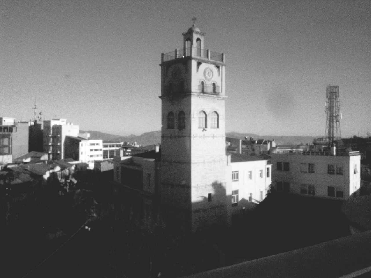 building exterior, architecture, built structure, church, religion, place of worship, tower, spirituality, clear sky, sky, city, cathedral, low angle view, clock tower, outdoors, history, tall - high, travel destinations