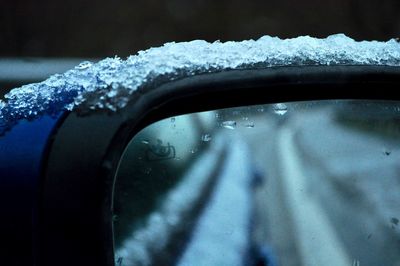Close-up of wet car windshield during rainy season