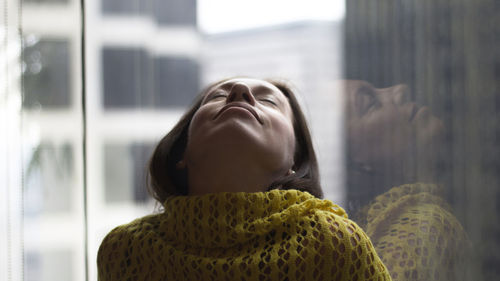 Close-up of young woman with eyes closed