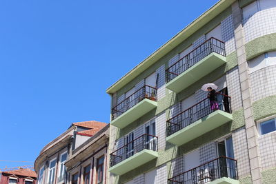 Low angle view of building against blue sky