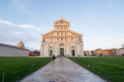 Pathway leading towards pisa cathedral against sky