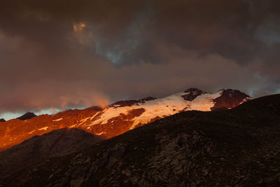 Dramatic sunset colors on peaks around the fontana glacier, alto adige, italy
