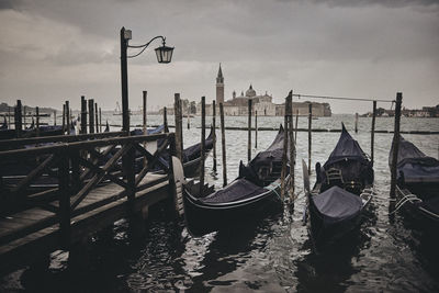 View of boats moored in canal