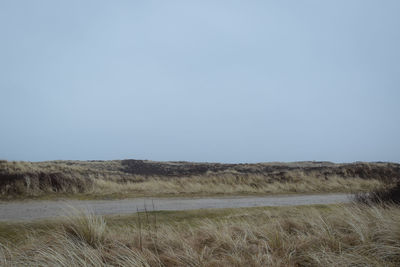 Scenic view of land against clear sky