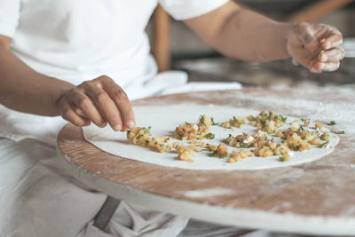 Midsection of man preparing food