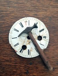 Close-up of clock on wood