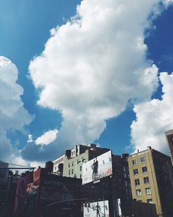 Low angle view of building against cloudy sky