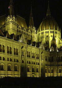 Illuminated buildings in city at night