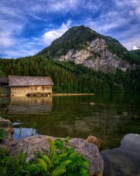 Scenic view of lake and mountains against sky