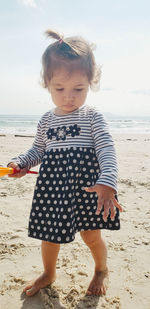 Portrait of girl standing at beach