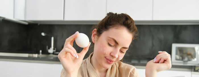 Close-up of young woman using mobile phone