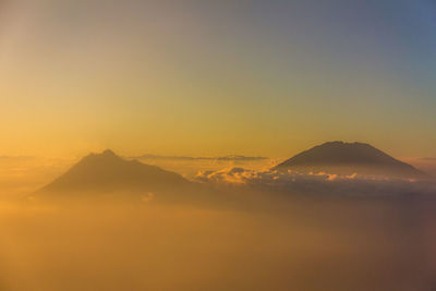 Scenic view of mountains against sky during sunset