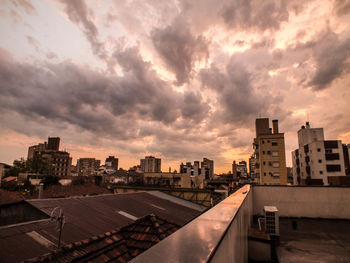 Cityscape against sky during sunset