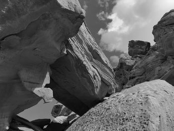 Low angle view of rock formation against sky