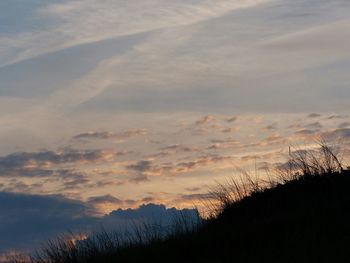 Scenic view of landscape against sky at sunset