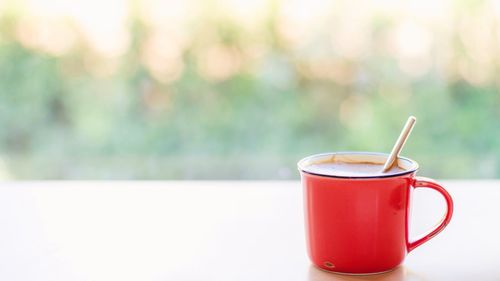Close-up of coffee cup on table