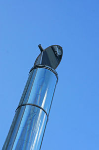 Low angle view of tower against clear blue sky