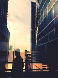 Buildings in city at sunset