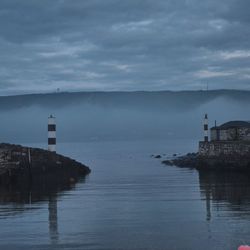 Scenic view of sea against cloudy sky