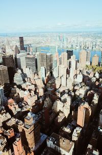 High angle view of city buildings against sky