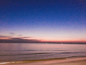 Scenic view of sea against sky at sunset