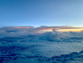 Aerial view of landscape against sky during sunset