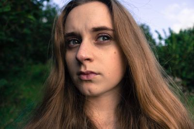 Close-up of young woman looking away