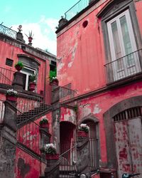 Low angle view of red building against sky