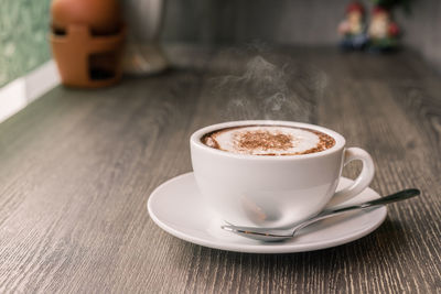 Close-up of coffee cup on table