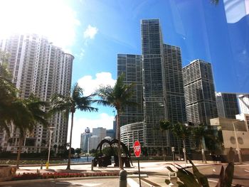 Low angle view of skyscrapers in city against sky