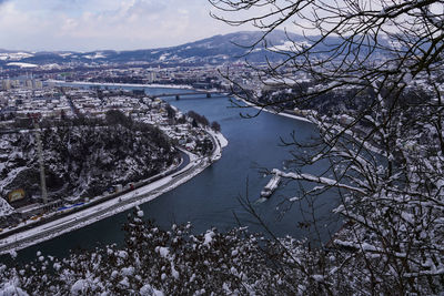 High angle view of river amidst buildings in city