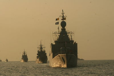 Ships on sea against clear sky