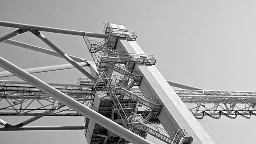 Low angle view of metal structure against clear sky