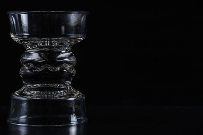 Close-up of glass bowls against black background