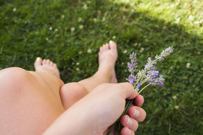 Close-up of hand holding flower