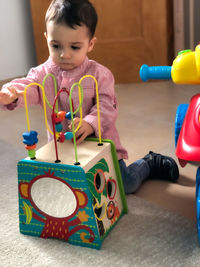 Portrait of boy playing with toy blocks