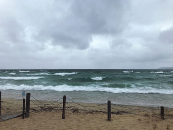 Stormy view of sea and waves against sky