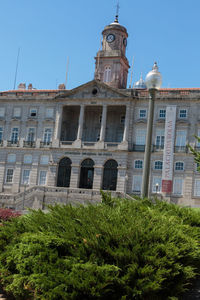 Low angle view of building against blue sky