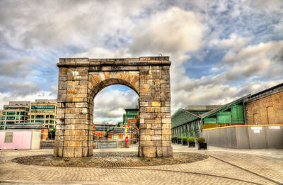 View of bridge against cloudy sky