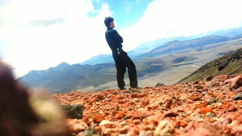 Silhouette of woman standing on mountain