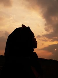Portrait of silhouette man against sky during sunset