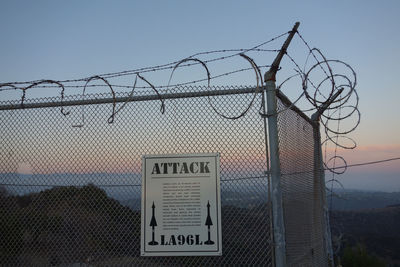 Close-up of chainlink fence against clear sky