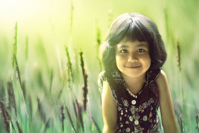 Portrait of a smiling girl in field