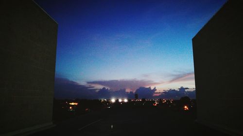 View of illuminated building against sky at night