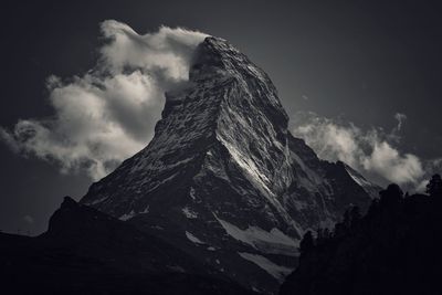 Scenic view of snowcapped mountains against sky during sunset